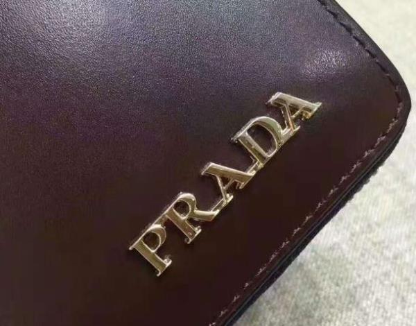 春夏に大活躍！PRADAプラダコピー財布ラウンドファスナーウォレットブラック、コーヒー色のメンズ長財布